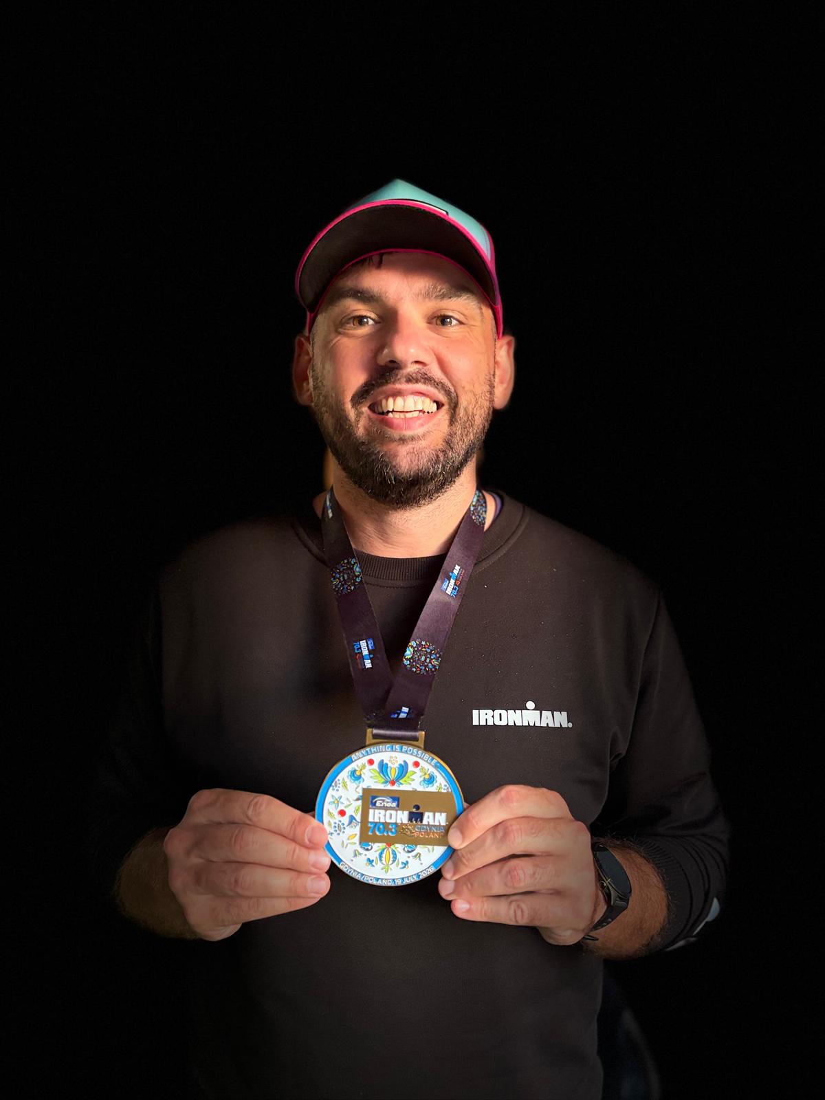 Mikołaj Lehman with his IRONMAN 70.3 Gdynia medal